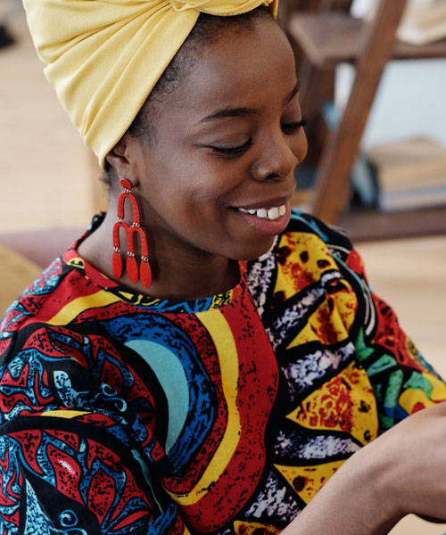 a woman in vibrant cultural clothing