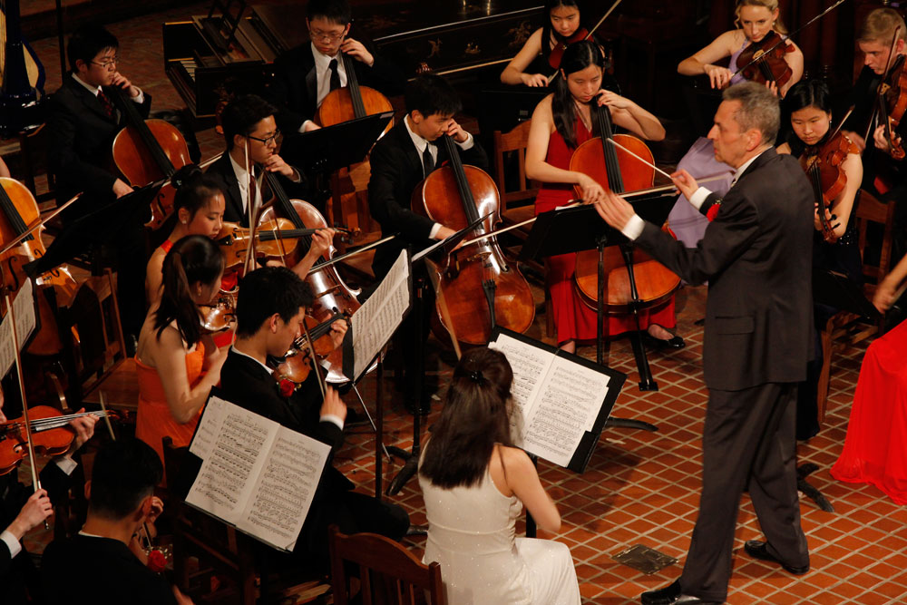a conductor with an orchestra